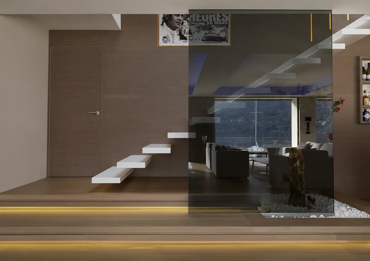 gradini di lusso a sbalzo in corian con parete in vetro fumé